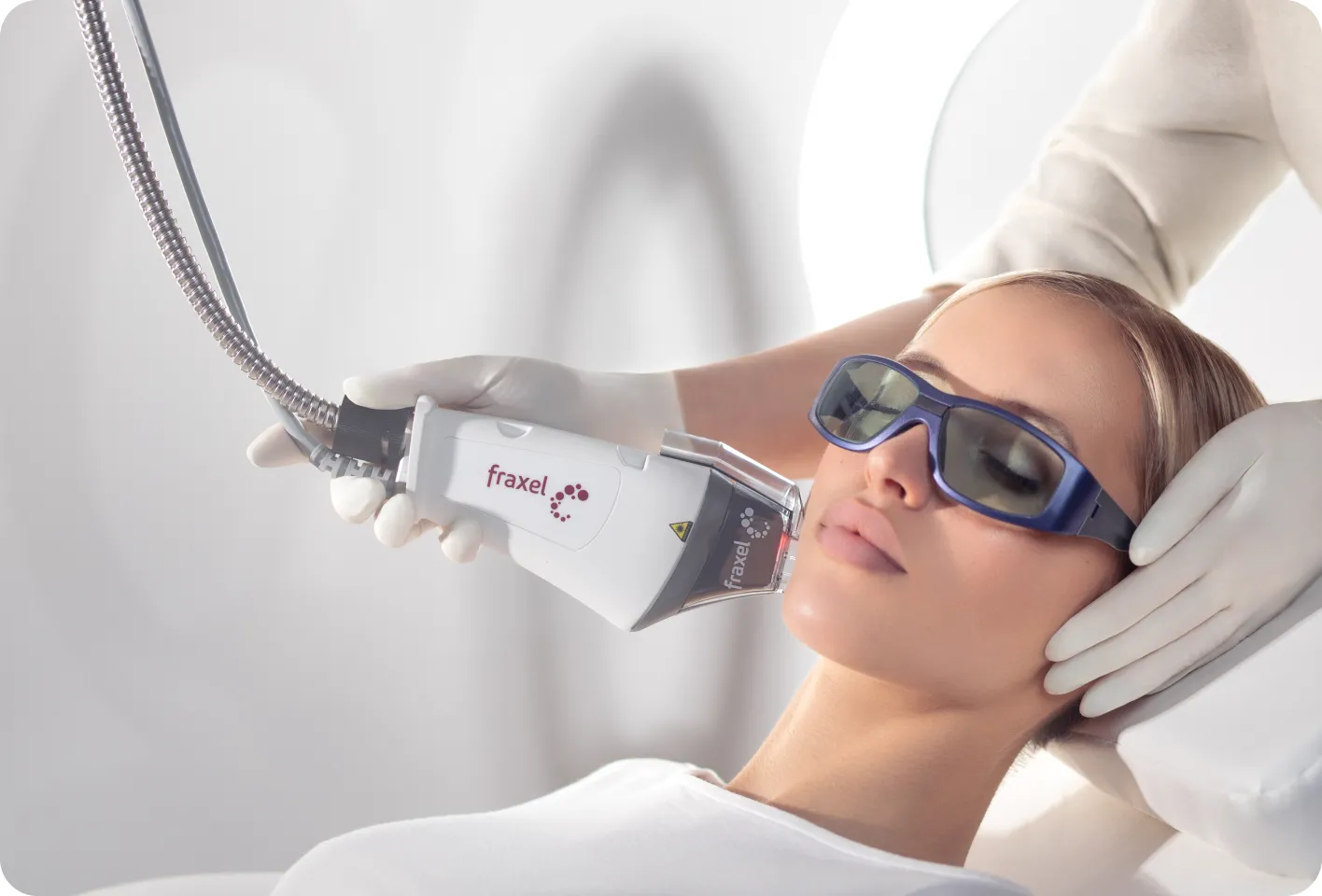 Patient receiving a Fraxel DUAL laser treatment on the cheek